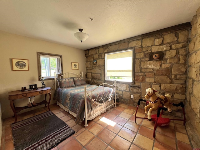 18173 Rd 22, Cortez, CO 81321 - bedroom featuring light tile patterned floors