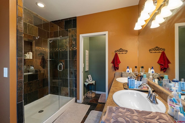 21 Tierra Verde Dr, Durango, CO 81301 - full bathroom featuring a chandelier, a stall shower, double vanity, and tile patterned flooring