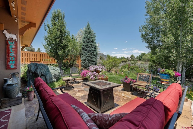 21 Tierra Verde Dr, Durango, CO 81301 - view of patio / terrace featuring an outdoor living space with a fire pit