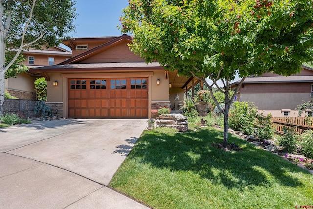 21 Tierra Verde Dr, Durango, CO 81301 - view of front of home featuring stone siding, an attached garage, driveway, and stucco siding