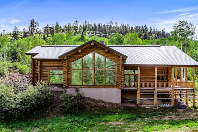 580 Lake Purgatory Dr, Durango, CO 81301 - view of front of property featuring a metal roof, a chimney, and log siding