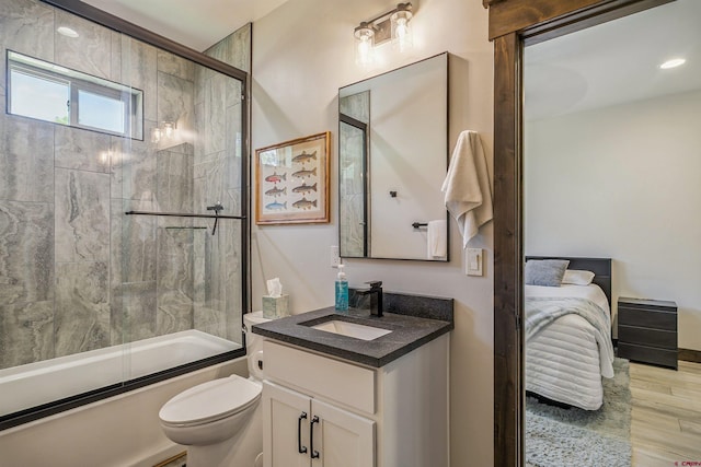 791 Antelope Ave, Pagosa Springs, CO 81147 - full bathroom with vanity, combined bath / shower with glass door, and wood finished floors