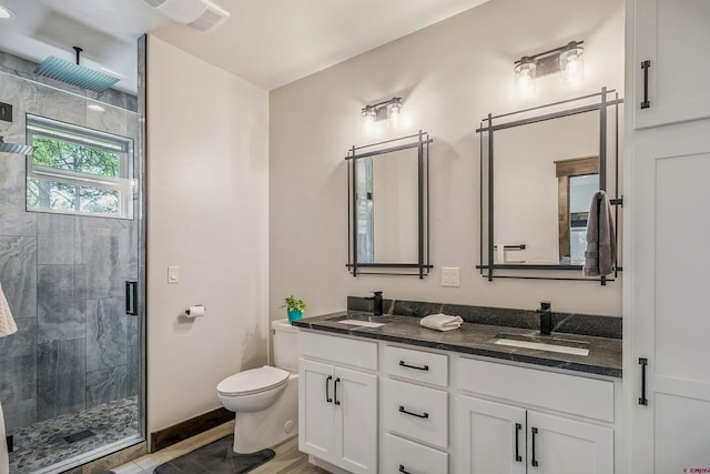 791 Antelope Ave, Pagosa Springs, CO 81147 - full bathroom featuring double vanity, a stall shower, and wood finished floors