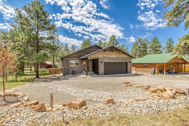 791 Antelope Ave, Pagosa Springs, CO 81147 - view of front facade with gravel driveway and a garage