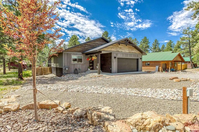 791 Antelope Ave, Pagosa Springs, CO 81147 - view of front of property featuring an attached garage and driveway