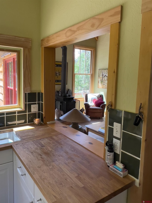 515 Bristol Rd, Placerville, CO 81430 - home office with a wood stove and a textured wall