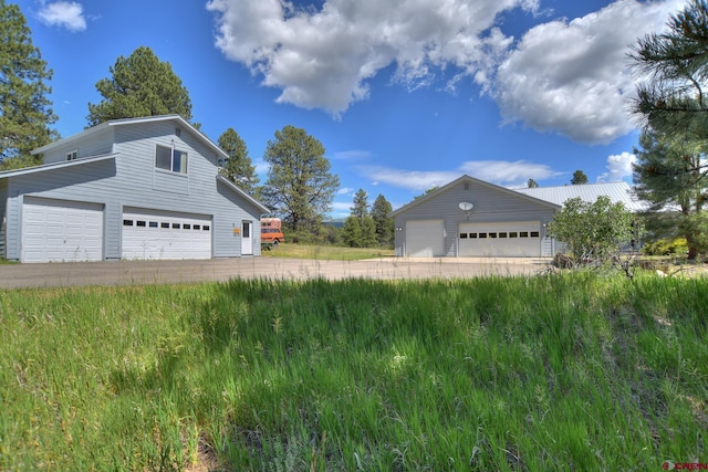 678 N Lakeside Dr, Durango, CO 81303 - view of side of home with a garage and an outbuilding