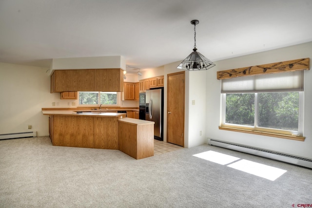 678 N Lakeside Dr, Durango, CO 81303 - kitchen with a baseboard heating unit, stainless steel fridge with ice dispenser, a peninsula, and light colored carpet