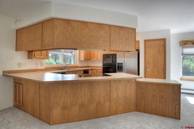 678 N Lakeside Dr, Durango, CO 81303 - kitchen featuring black appliances, carpet, a peninsula, and light countertops