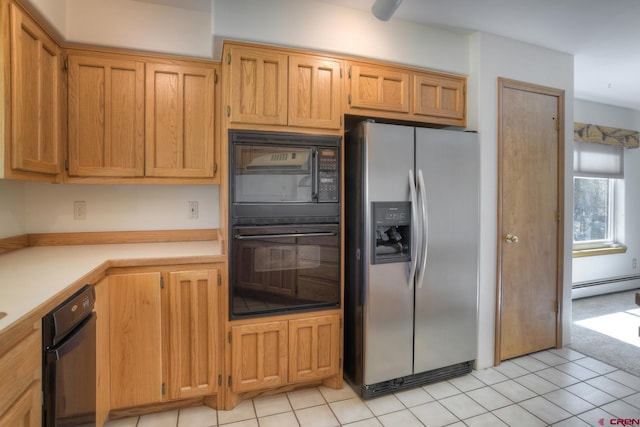 678 N Lakeside Dr, Durango, CO 81303 - kitchen featuring black appliances, a baseboard radiator, light countertops, and light tile patterned floors