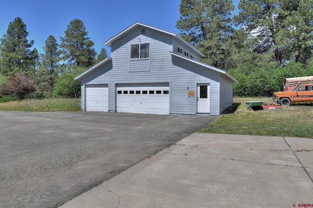 678 N Lakeside Dr, Durango, CO 81303 - view of home's exterior with driveway and a garage