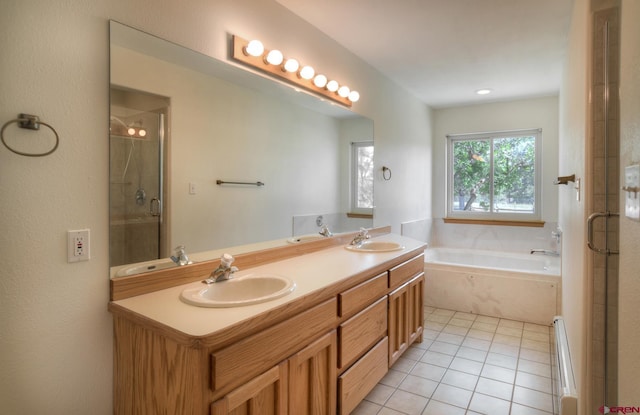 678 N Lakeside Dr, Durango, CO 81303 - full bath featuring a garden tub, double vanity, tile patterned floors, a stall shower, and baseboard heating