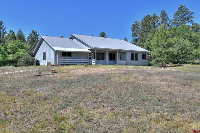 678 N Lakeside Dr, Durango, CO 81303 - view of front of house with a front yard and a metal roof