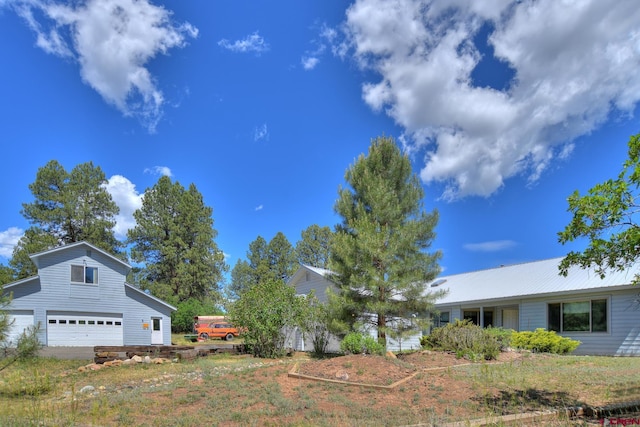 678 N Lakeside Dr, Durango, CO 81303 - view of yard featuring a garage
