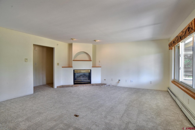 678 N Lakeside Dr, Durango, CO 81303 - unfurnished living room with a baseboard radiator, a glass covered fireplace, and carpet floors