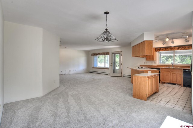 678 N Lakeside Dr, Durango, CO 81303 - kitchen featuring a baseboard heating unit, light colored carpet, open floor plan, light countertops, and pendant lighting