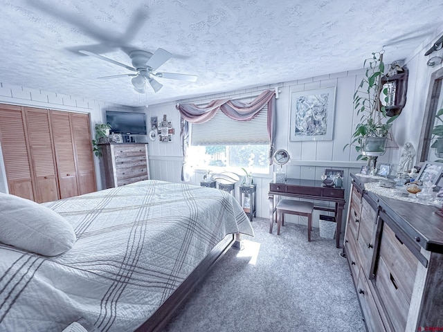 27126 Road R, Dolores, CO 81323 - carpeted bedroom with ceiling fan, a textured ceiling, and a closet