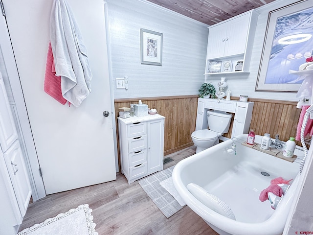 27126 Road R, Dolores, CO 81323 - bathroom with wood walls, a wainscoted wall, a tub to relax in, wood finished floors, and wooden ceiling