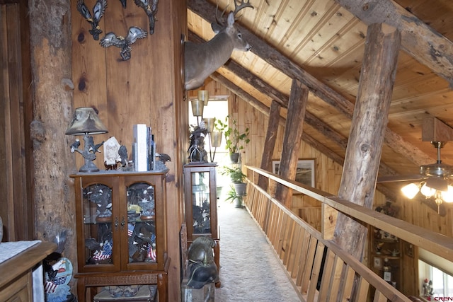 27126 Road R, Dolores, CO 81323 - hall featuring wood walls, carpet floors, and wooden ceiling