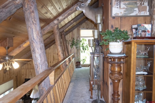 27126 Road R, Dolores, CO 81323 - hallway with wood walls, wood ceiling, and carpet floors
