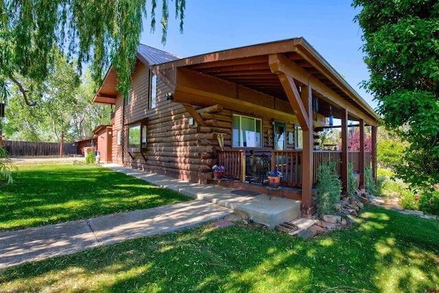 27126 Road R, Dolores, CO 81323 - view of side of property with log siding and a metal roof
