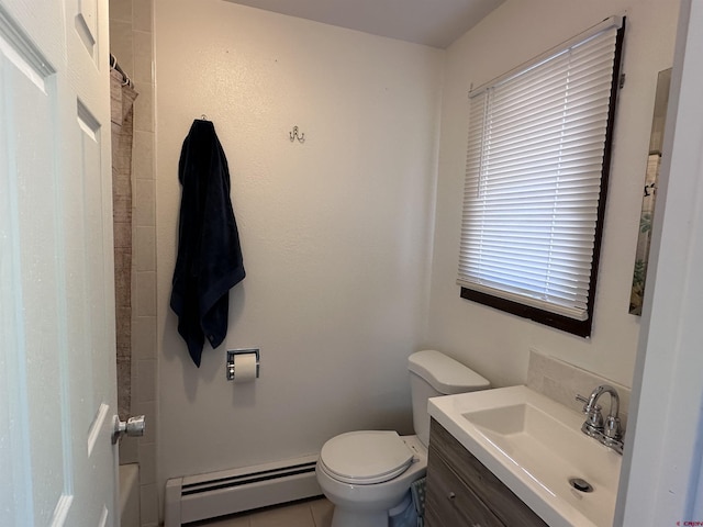 9456 6075th Rd, Montrose, CO 81403 - bathroom with baseboard heating, vanity, a shower, and tile patterned floors
