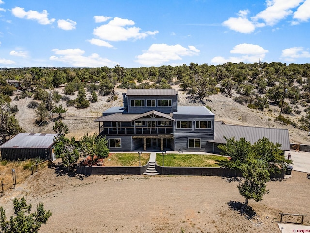 27420 Rd P.2, Dolores, CO 81323 - rear view of house featuring a metal roof and a balcony