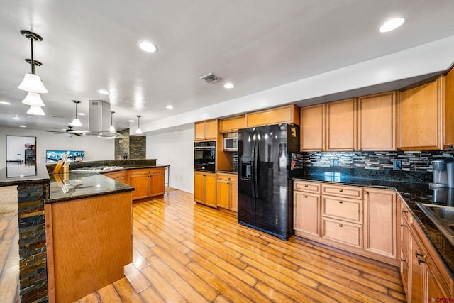 27420 Rd P.2, Dolores, CO 81323 - kitchen featuring black appliances, island exhaust hood, decorative backsplash, light wood-style flooring, and ceiling fan
