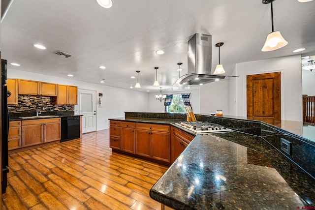 27420 Rd P.2, Dolores, CO 81323 - kitchen featuring island exhaust hood, black dishwasher, gas cooktop, brown cabinets, and wood finished floors