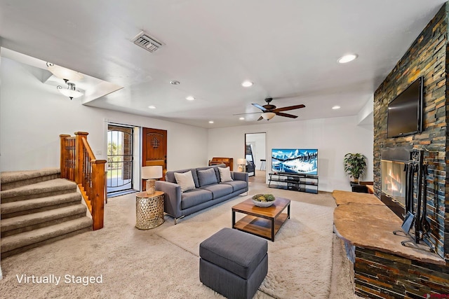 27420 Rd P.2, Dolores, CO 81323 - living area featuring recessed lighting, stairs, ceiling fan, a stone fireplace, and carpet floors