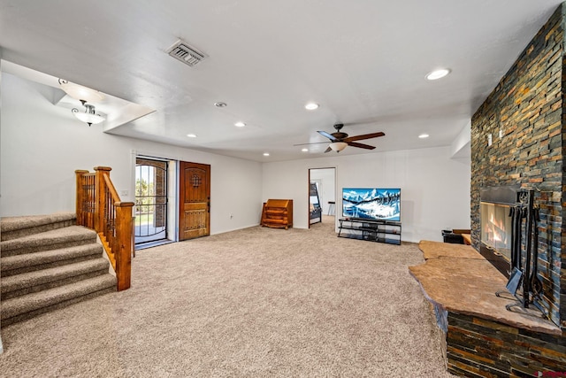 27420 Rd P.2, Dolores, CO 81323 - living area with carpet flooring, recessed lighting, ceiling fan, stairs, and a stone fireplace