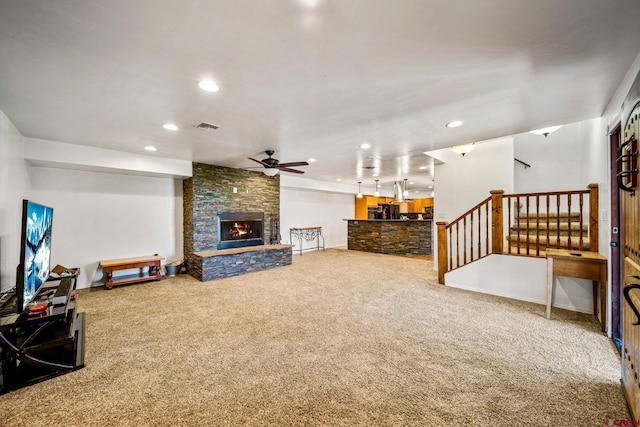 27420 Rd P.2, Dolores, CO 81323 - living area featuring carpet, a ceiling fan, a stone fireplace, recessed lighting, and stairway