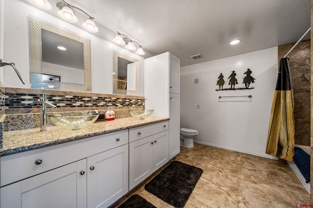 27420 Rd P.2, Dolores, CO 81323 - bathroom with vanity and decorative backsplash