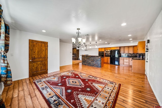 27420 Rd P.2, Dolores, CO 81323 - living room featuring a chandelier, light wood-type flooring, and recessed lighting