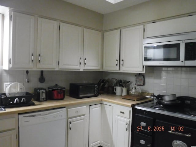 47 Segovia Dr, Hot Springs, AR 71909 - kitchen with stainless steel microwave, white dishwasher, and white cabinets