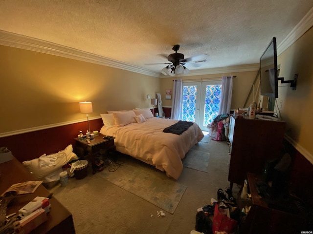 bedroom with access to exterior, carpet floors, ornamental molding, ceiling fan, and a textured ceiling