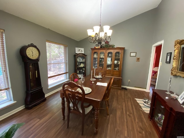 dining space featuring lofted ceiling, baseboards, a chandelier, and dark wood finished floors