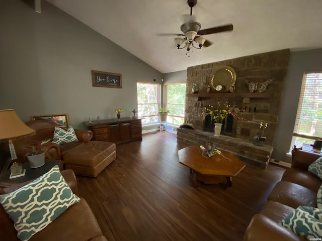 living room featuring ceiling fan, a stone fireplace, wood finished floors, and a wealth of natural light