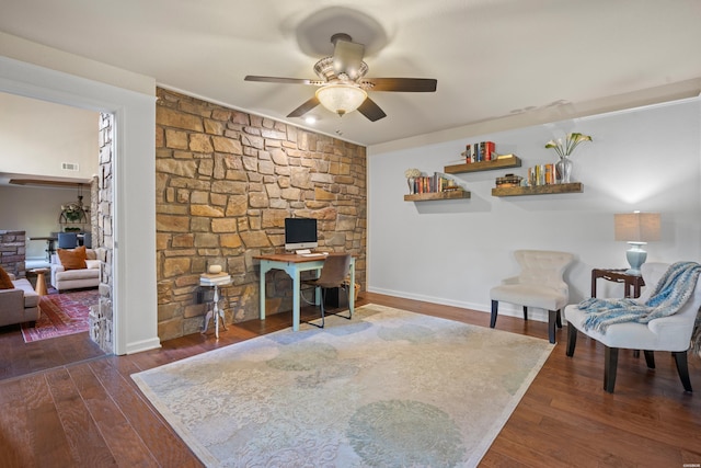 home office featuring a ceiling fan, dark wood-style flooring, visible vents, and baseboards