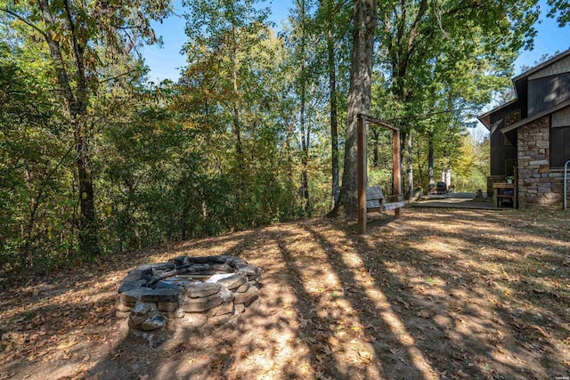 view of yard featuring a fire pit