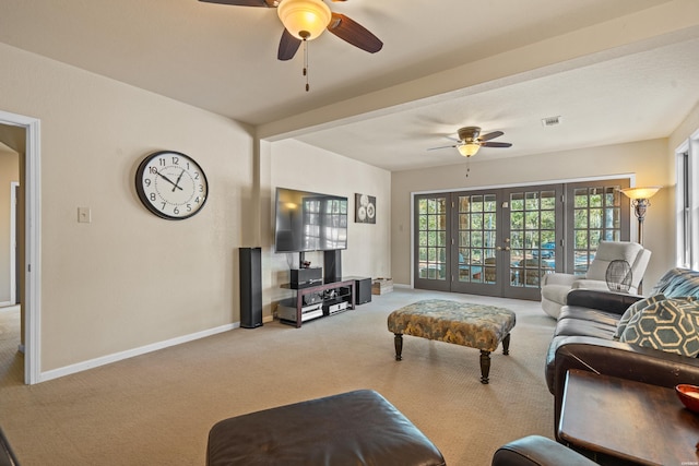 living area featuring a ceiling fan, french doors, light colored carpet, and baseboards