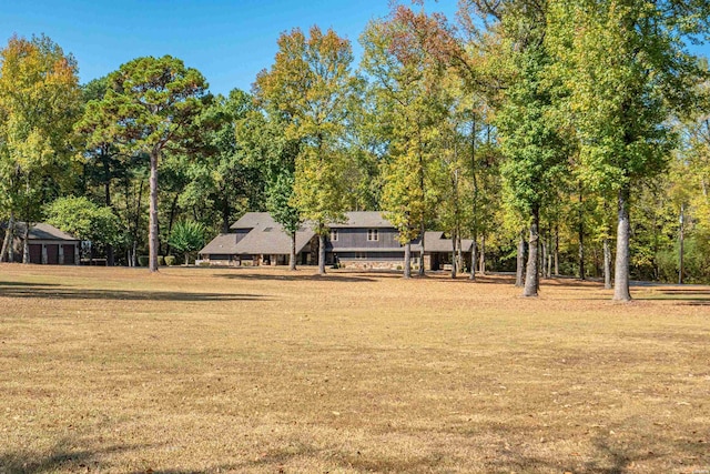 view of home's community with a lawn