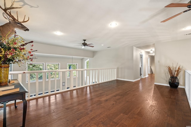 empty room featuring recessed lighting, visible vents, a ceiling fan, baseboards, and dark wood finished floors