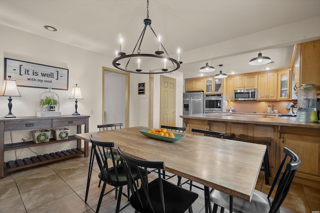 dining room with recessed lighting and light tile patterned flooring