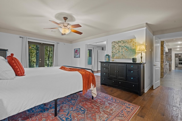 bedroom with dark wood-style floors, access to exterior, a ceiling fan, and french doors