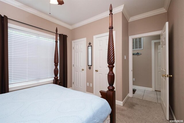 1745 Thornton Ferry Rd, Hot Springs, AR 71913 - bedroom featuring a ceiling fan, two closets, baseboards, light colored carpet, and ornamental molding