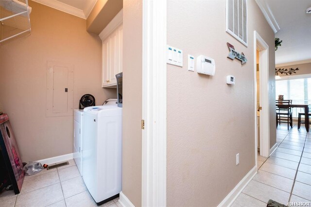 1745 Thornton Ferry Rd, Hot Springs, AR 71913 - washroom featuring light tile patterned flooring, visible vents, crown molding, separate washer and dryer, and cabinet space