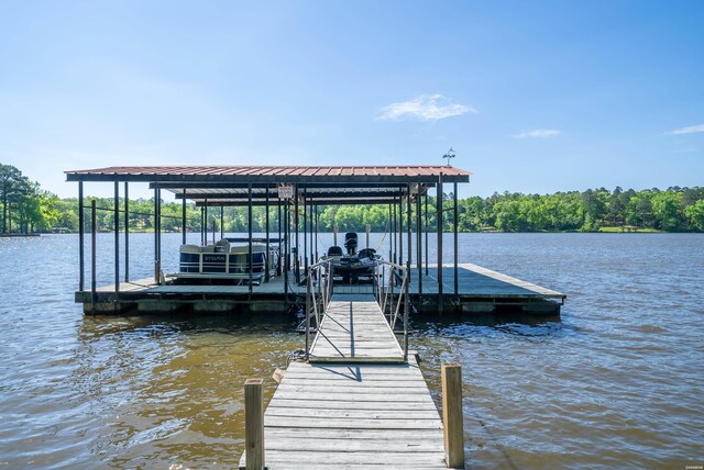 view of dock featuring a water view and boat lift