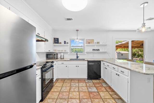 kitchen featuring a peninsula, a sink, white cabinets, hanging light fixtures, and black appliances