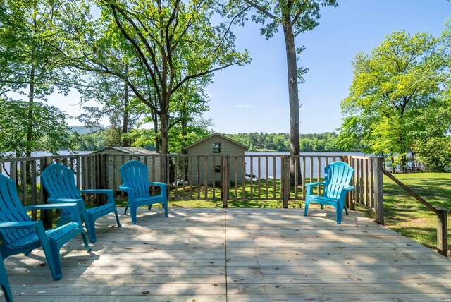 deck featuring a storage unit and an outdoor structure